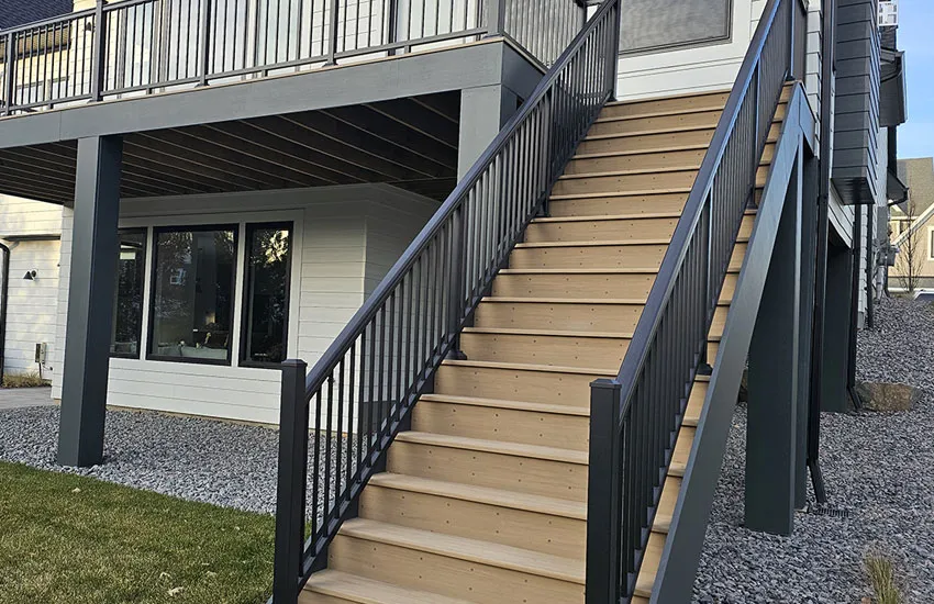 Custom deck stairs with composite treads and aluminum railings
